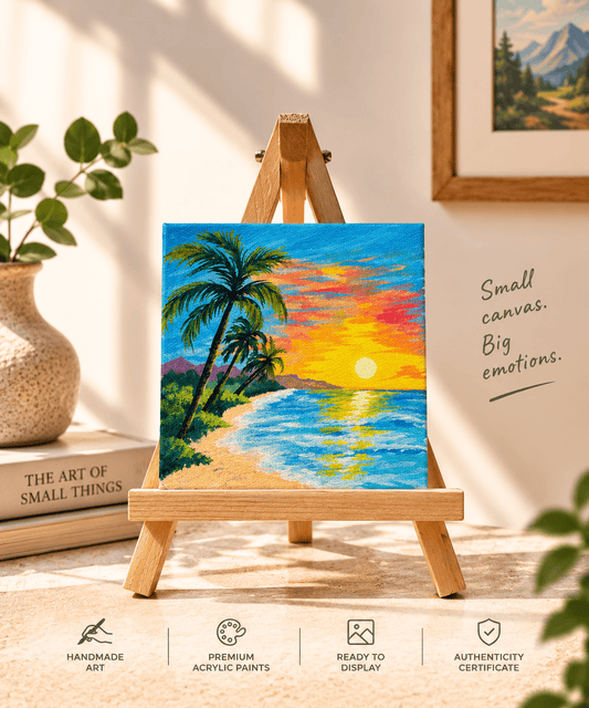 A small square acrylic painting of a tropical beach sunset displayed on a wooden easel. The painting features green palm trees, a sandy beach, blue ocean water, and a bright yellow and orange sun over a blue sky.