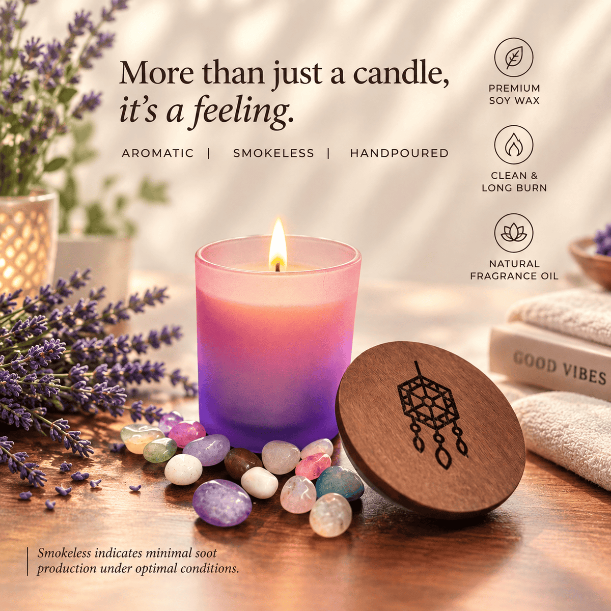 A lit candle in a purple-to-pink gradient glass jar sits on a wooden surface with lavender sprigs, decorative stones, a wooden lid engraved with a dreamcatcher design, and soft-focus background props including towels and plants. Text on the image highlights premium soy wax, smokeless burn, and natural fragrance oil.